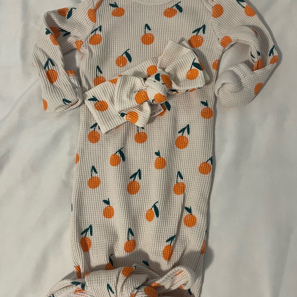 Spearmint baby Orange Print Kids One Piece and bow.